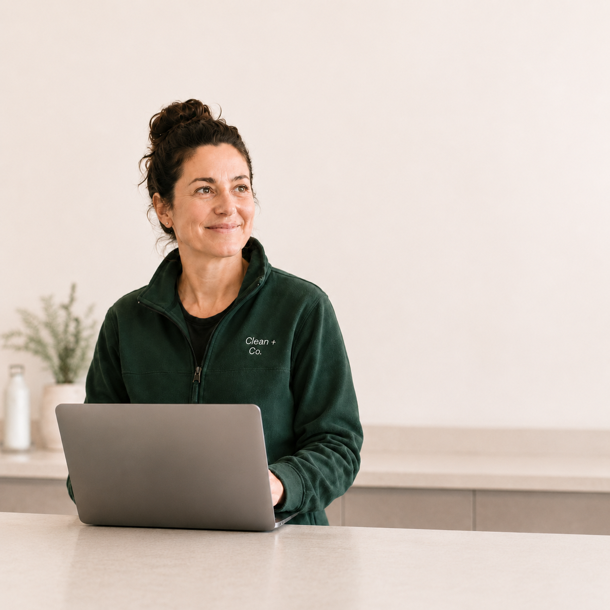 Cleaning business operator at her laptop